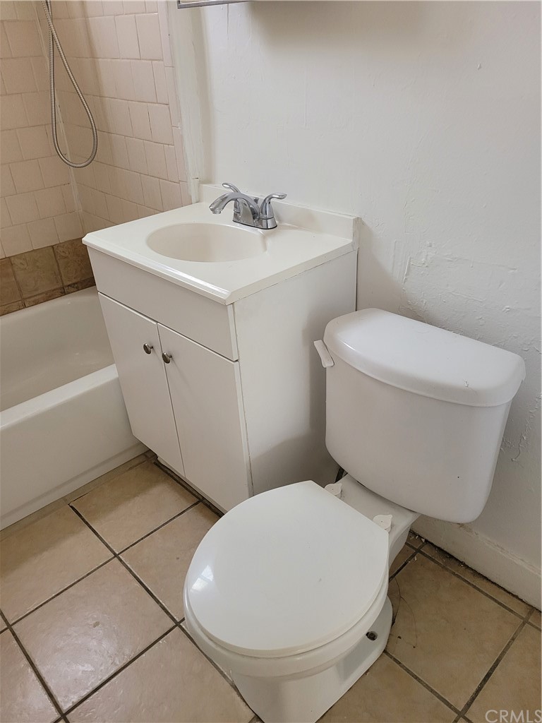 3077 Lemon Street Riverside, CA 92501 - Photo 13 of 20 a bathroom with a sink and a toilet