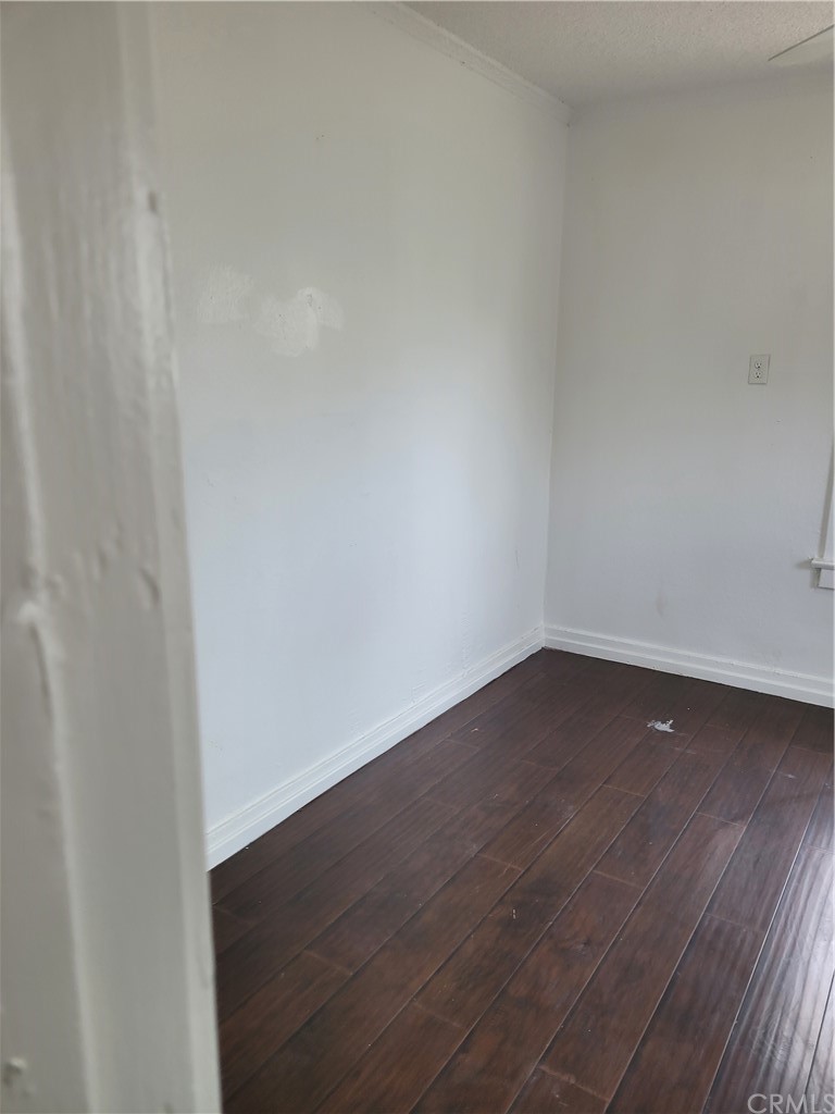 3077 Lemon Street Riverside, CA 92501 - Photo 2 of 20 a view of an empty room with wooden floor