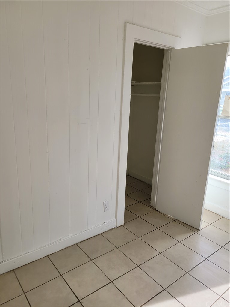3077 Lemon Street Riverside, CA 92501 - Photo 6 of 20 an empty room with wooden door