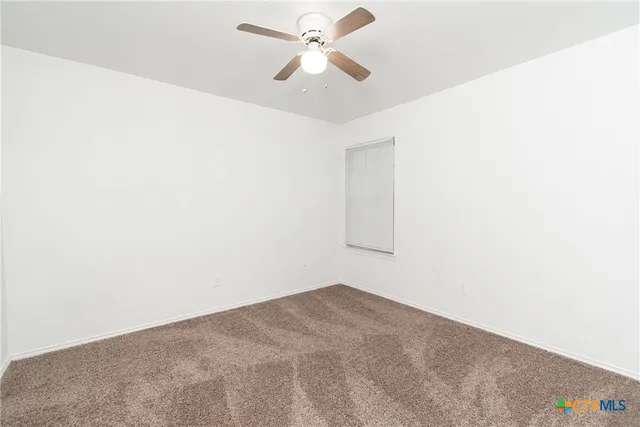 a view of a big room with carpet