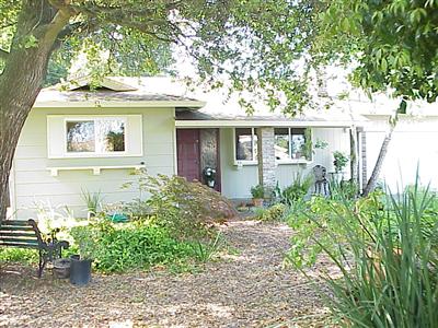 7138 Raymond Road Sebastopol, CA 95472 - Photo 1 of 7 a front view of a house with garden