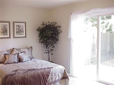 7138 Raymond Road Sebastopol, CA 95472 - Photo 4 of 7 a bedroom with a bed and a window
