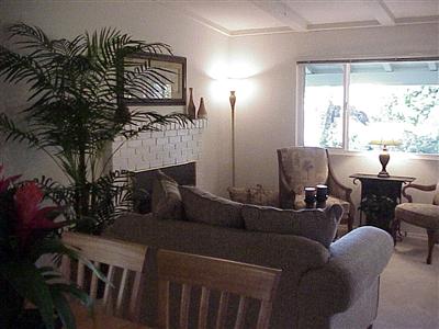 7138 Raymond Road Sebastopol, CA 95472 - Photo 5 of 7 a living room with furniture a window and a fireplace