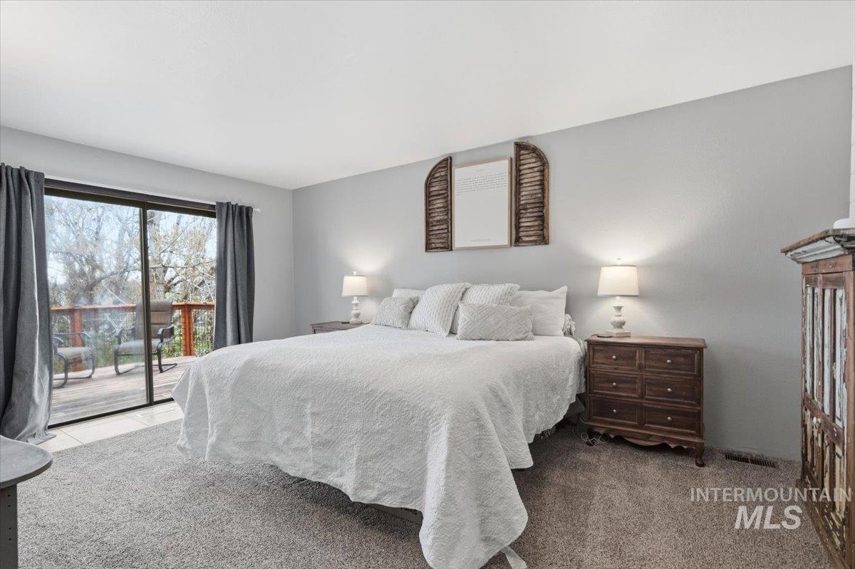 7771 Elmore Road Fruitland, ID 83619 - Photo 13 of 48 Master bedroom with private patio.