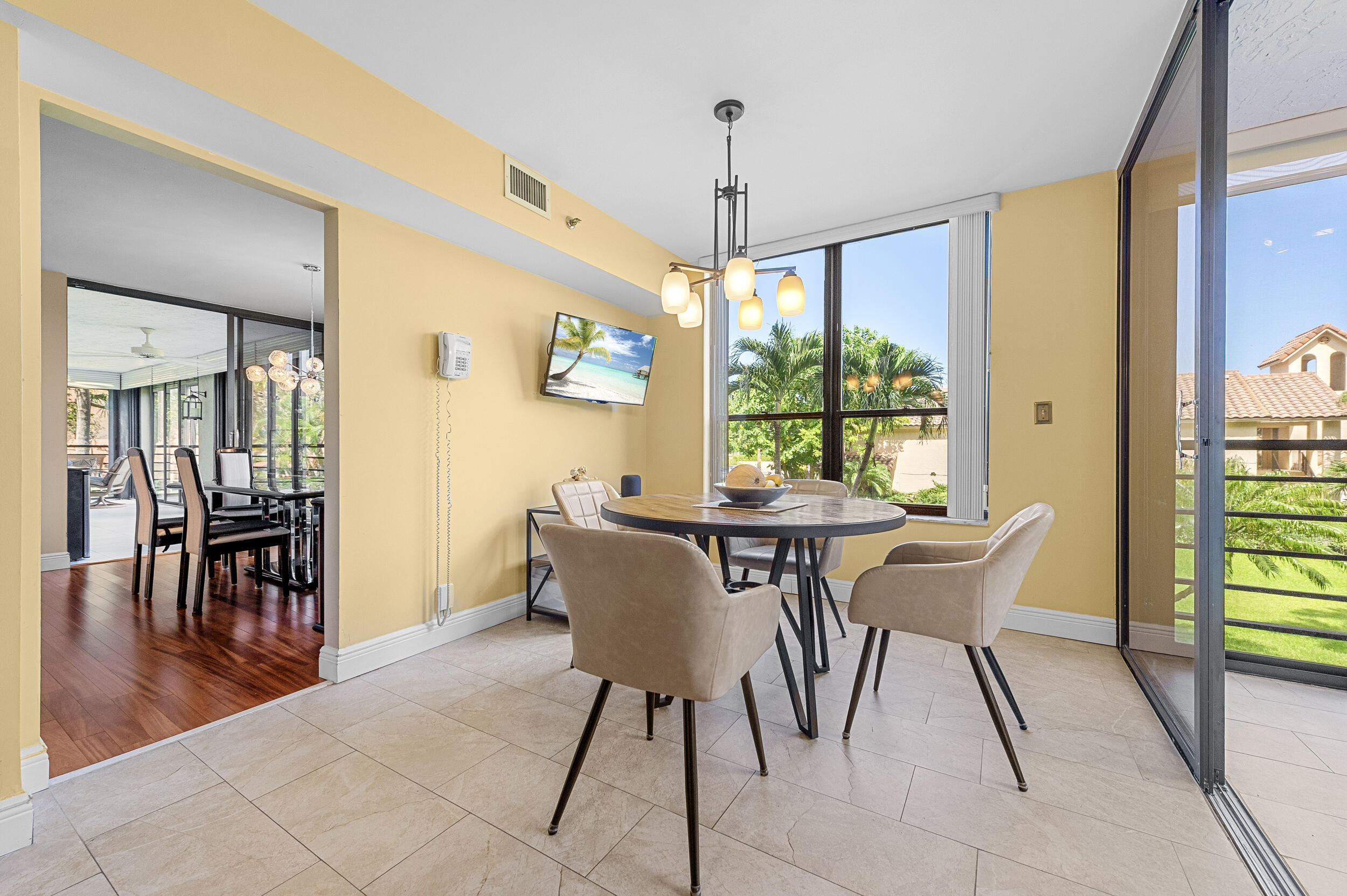 7209 Promenade Drive, Unit 201 Boca Raton, FL 33433 - Photo 21 of 41 a view of a dining room with furniture window and outside view