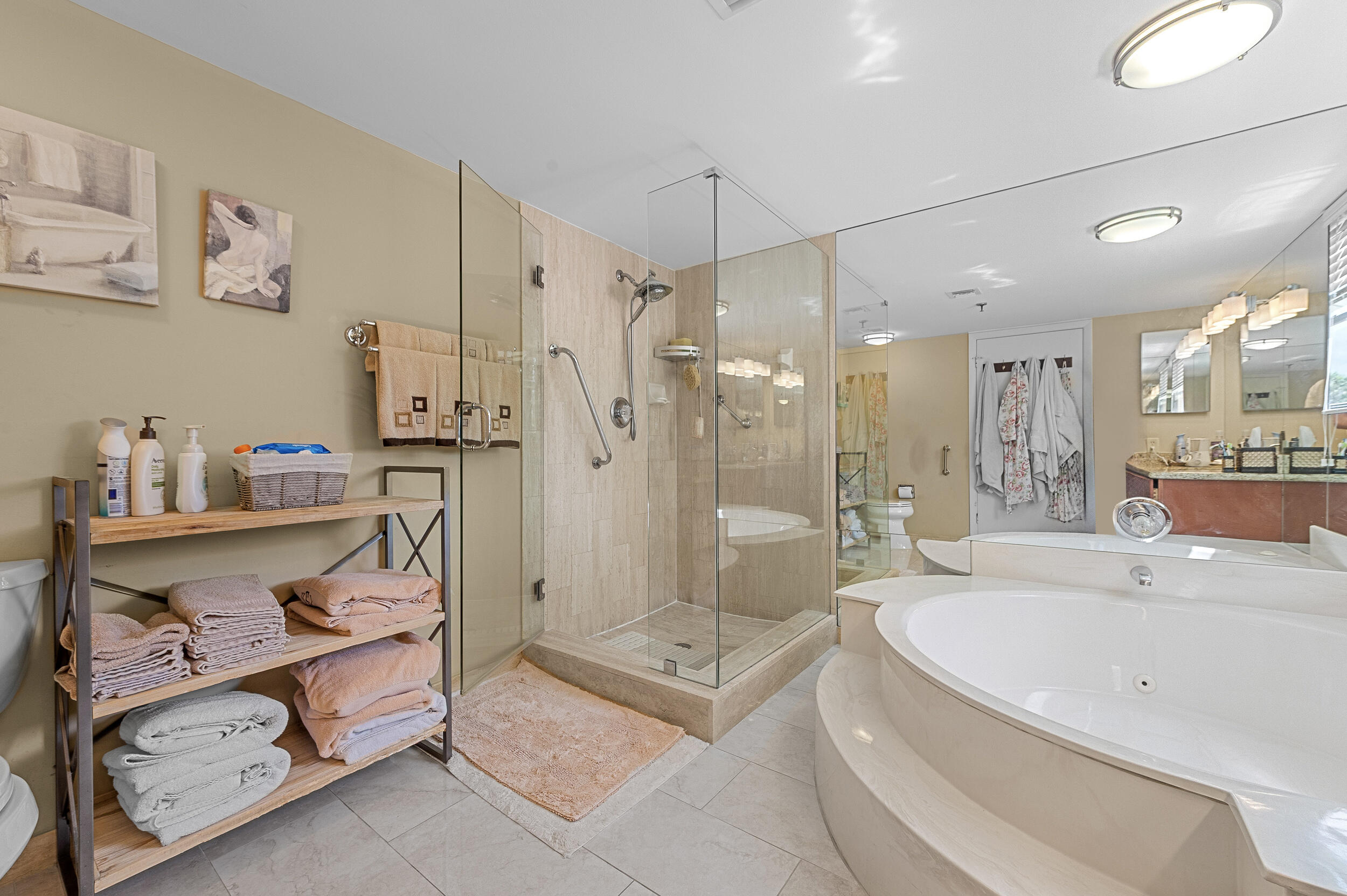 7209 Promenade Drive, Unit 201 Boca Raton, FL 33433 - Photo 29 of 41 a spacious bathroom with a tub shower and mirror