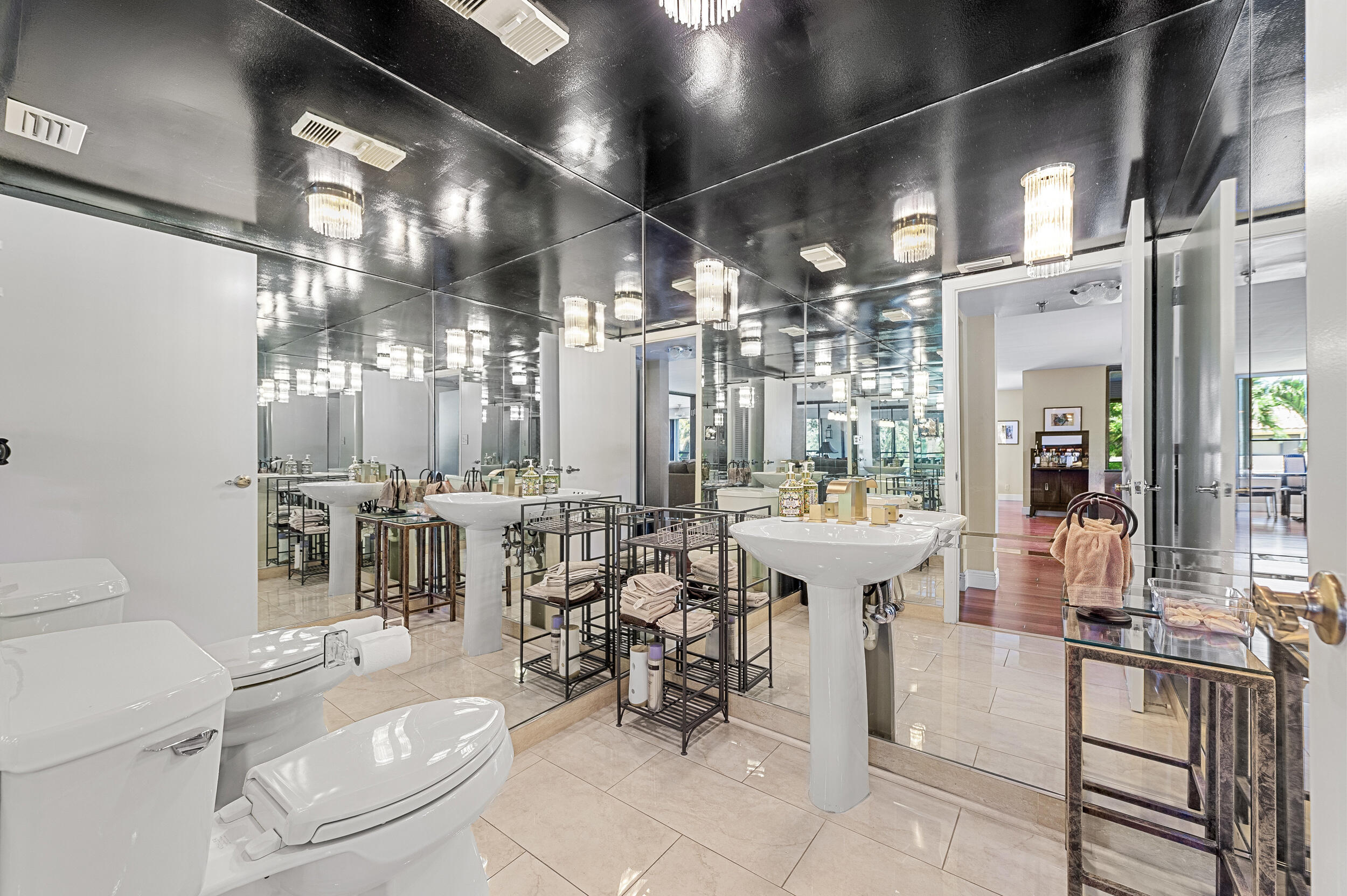 7209 Promenade Drive, Unit 201 Boca Raton, FL 33433 - Photo 34 of 41 a room with lots of white furniture and chandelier