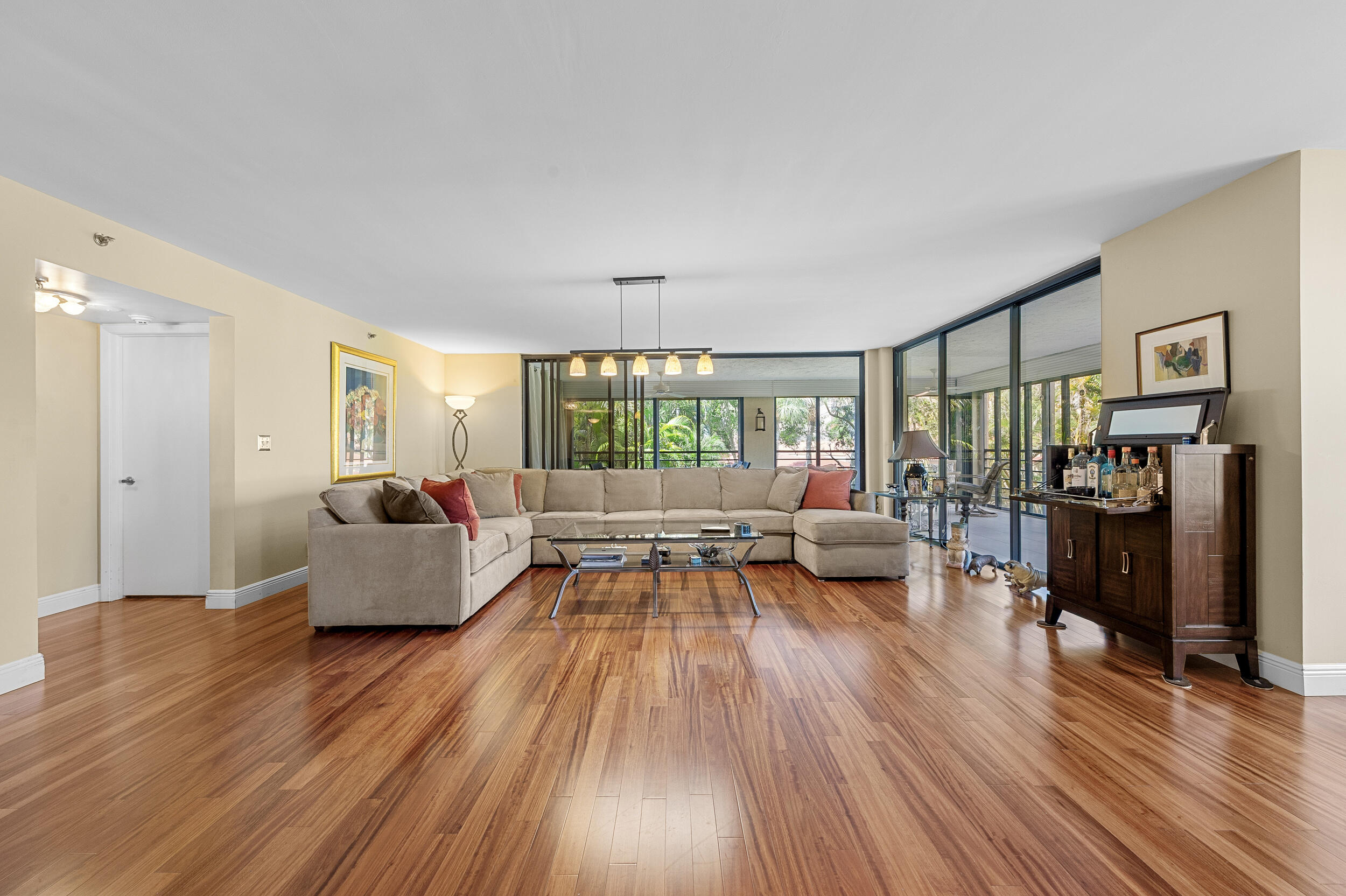 7209 Promenade Drive, Unit 201 Boca Raton, FL 33433 - Photo 7 of 41 a living room with furniture and a wooden floor