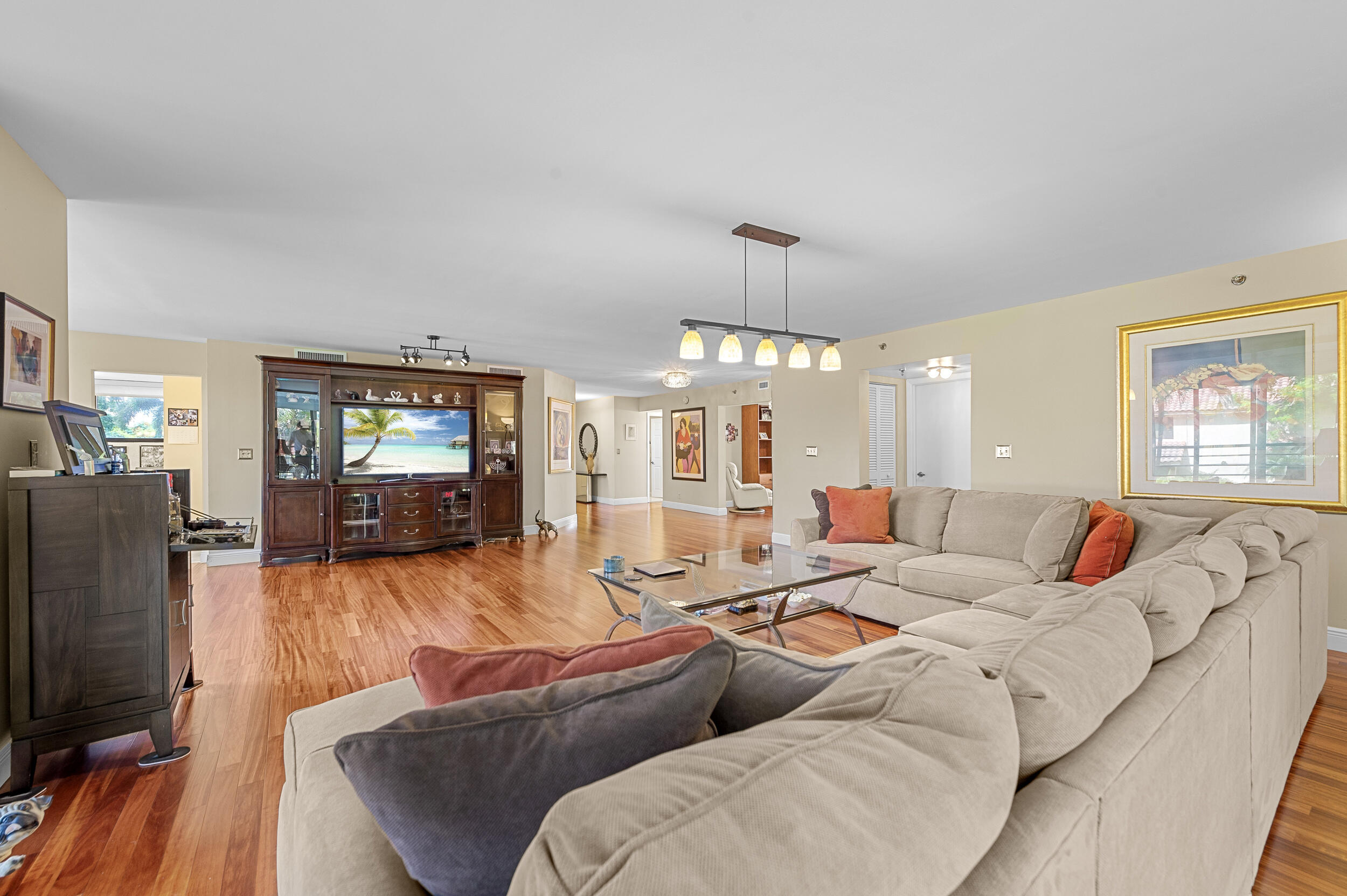 7209 Promenade Drive, Unit 201 Boca Raton, FL 33433 - Photo 8 of 41 a living room with furniture and a flat screen tv