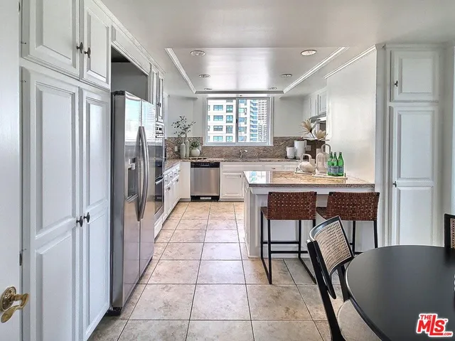 a view of a dining room with furniture and window