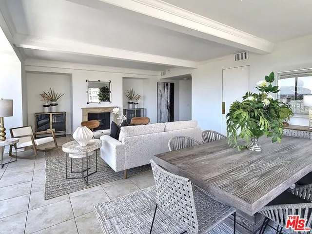 a view of a dining room with furniture and window