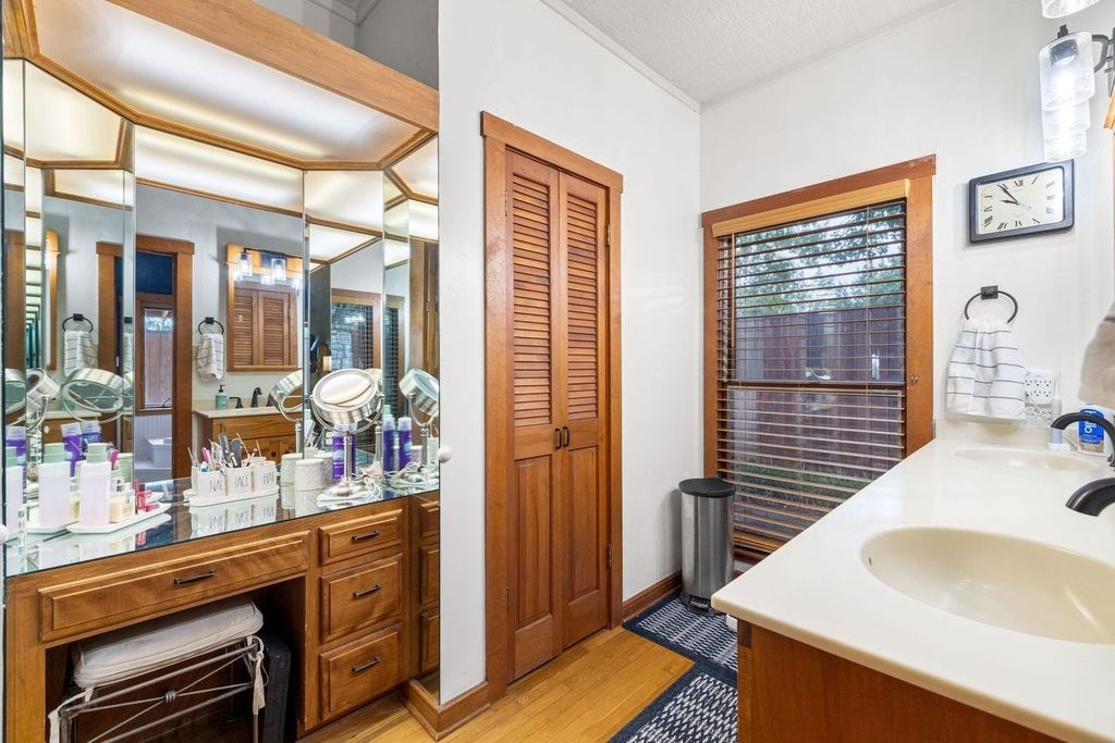 257 Encino Loop Kerrville, TX 78028 - Photo 16 of 92 a bathroom with a sink and a large mirror