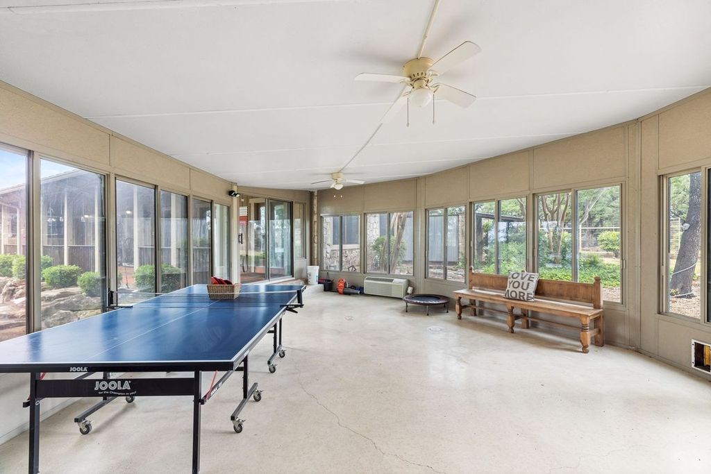 257 Encino Loop Kerrville, TX 78028 - Photo 25 of 92 a view of a patio with a table and chairs