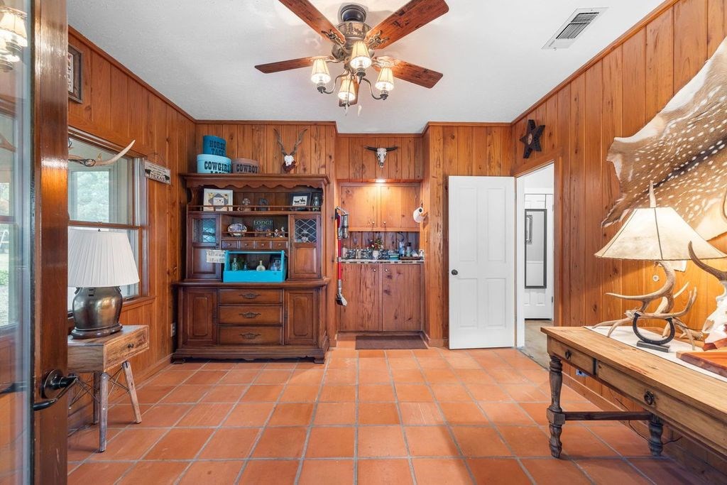 257 Encino Loop Kerrville, TX 78028 - Photo 30 of 92 a room with furniture a lamp and a window