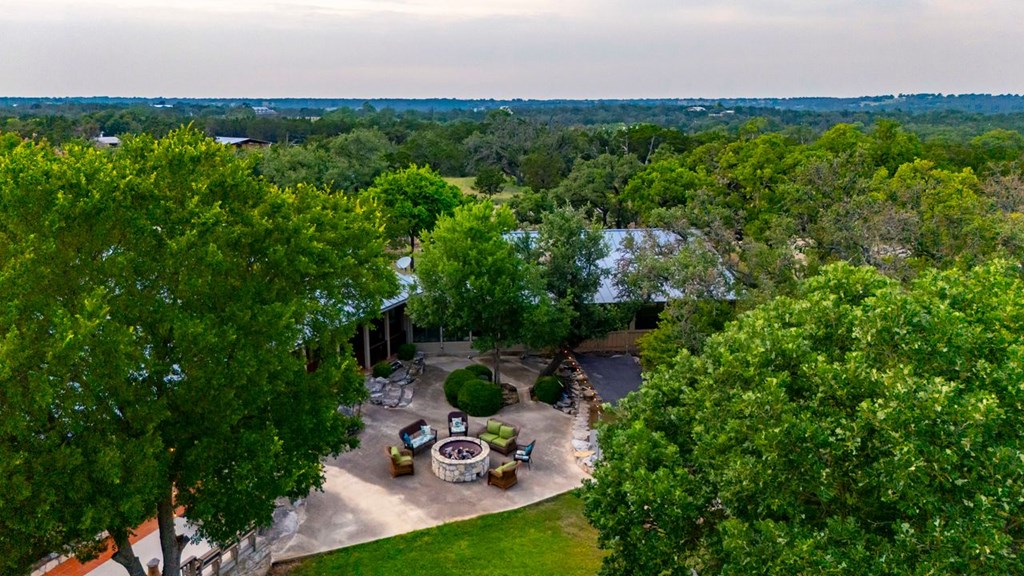 257 Encino Loop Kerrville, TX 78028 - Photo 46 of 92 a view of a backyard with plants and a garden
