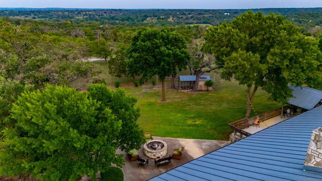 257 Encino Loop Kerrville, TX 78028 - Photo 47 of 92 a view of a wooden deck and a yard