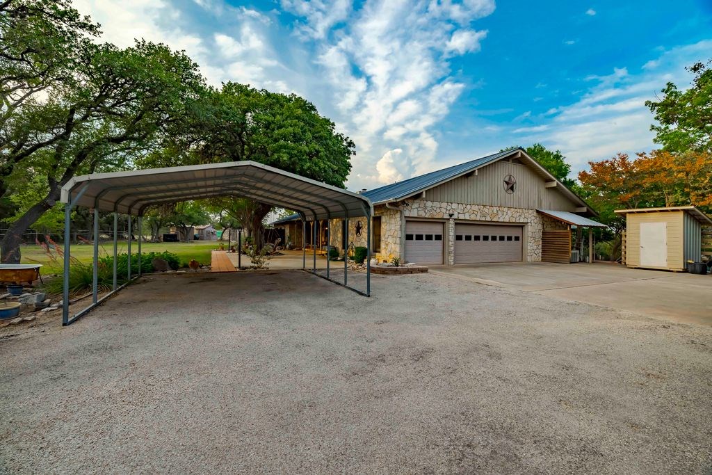 257 Encino Loop Kerrville, TX 78028 - Photo 57 of 92 a view of a house with a yard and sitting area