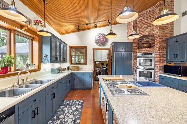 a bedroom with furniture and a wooden floor