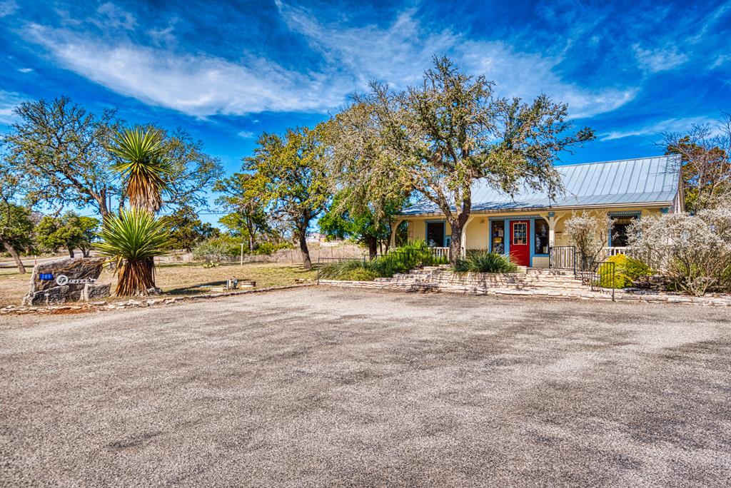 257 Encino Loop Kerrville, TX 78028 - Photo 91 of 92 front view of a house with a street