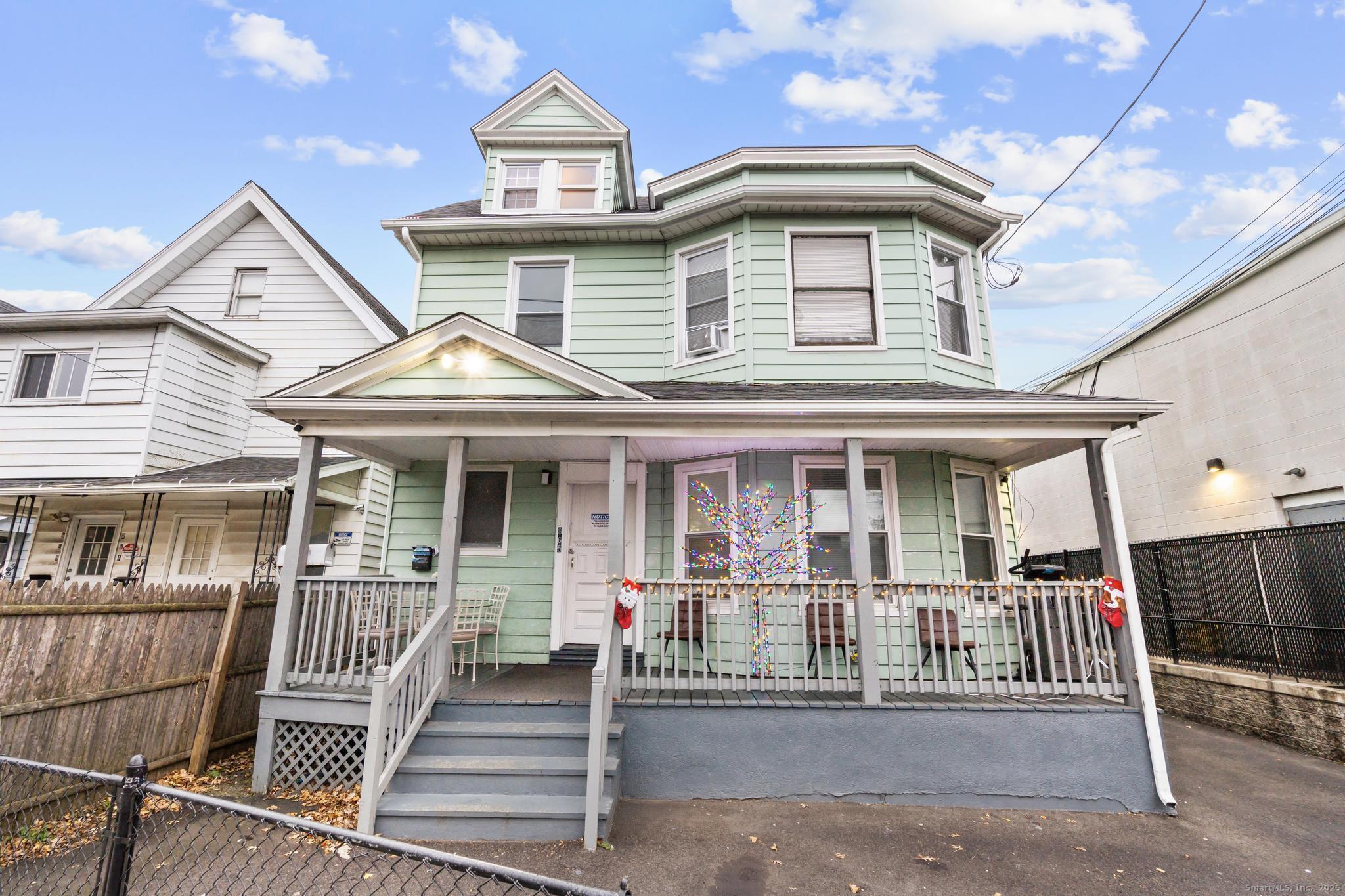 865 Iranistan Avenue Bridgeport, CT 06605 - Photo 1 of 35 a front view of a house with a porch