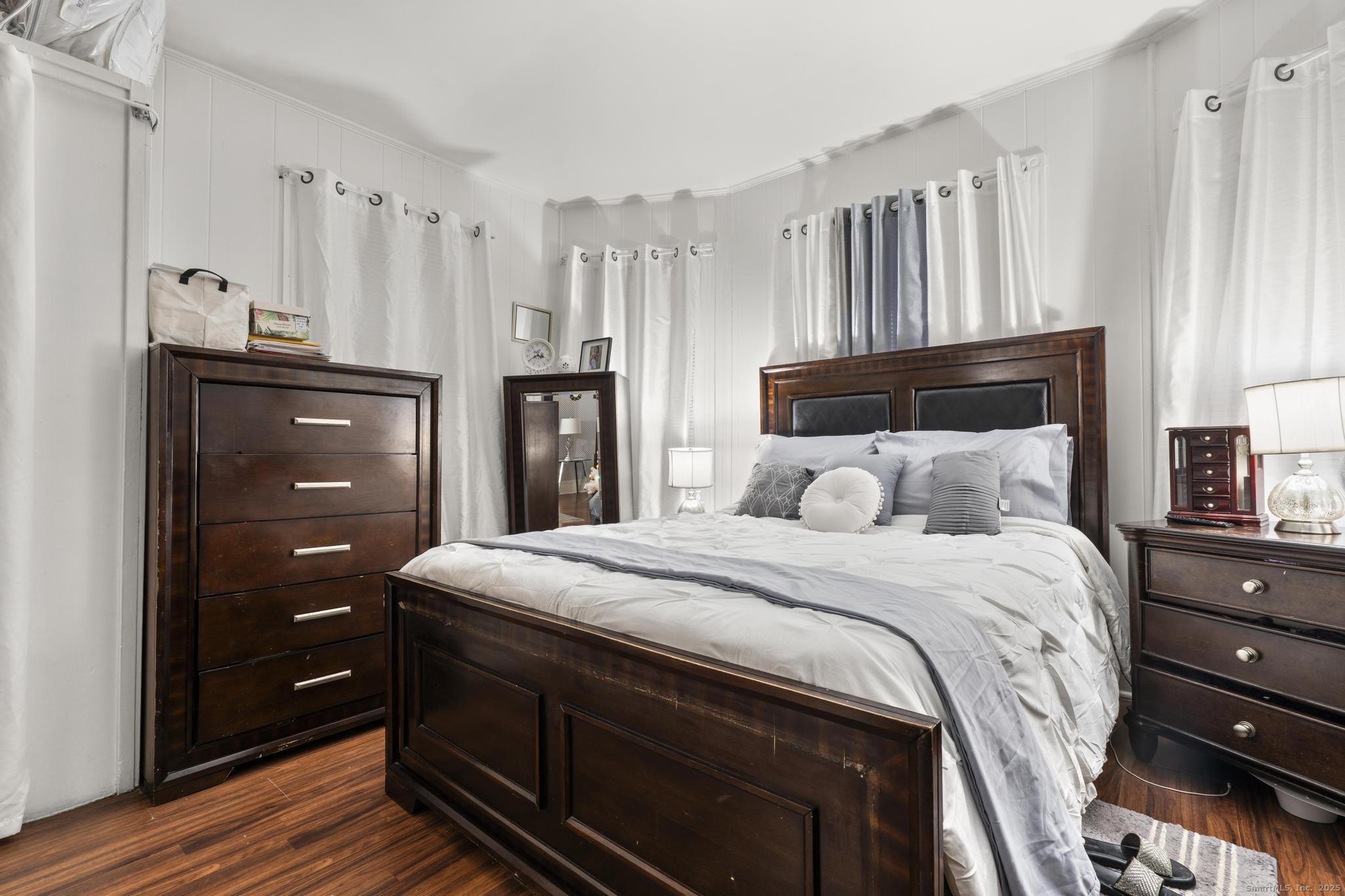 865 Iranistan Avenue Bridgeport, CT 06605 - Photo 11 of 35 a bedroom with a bed and a cabinets