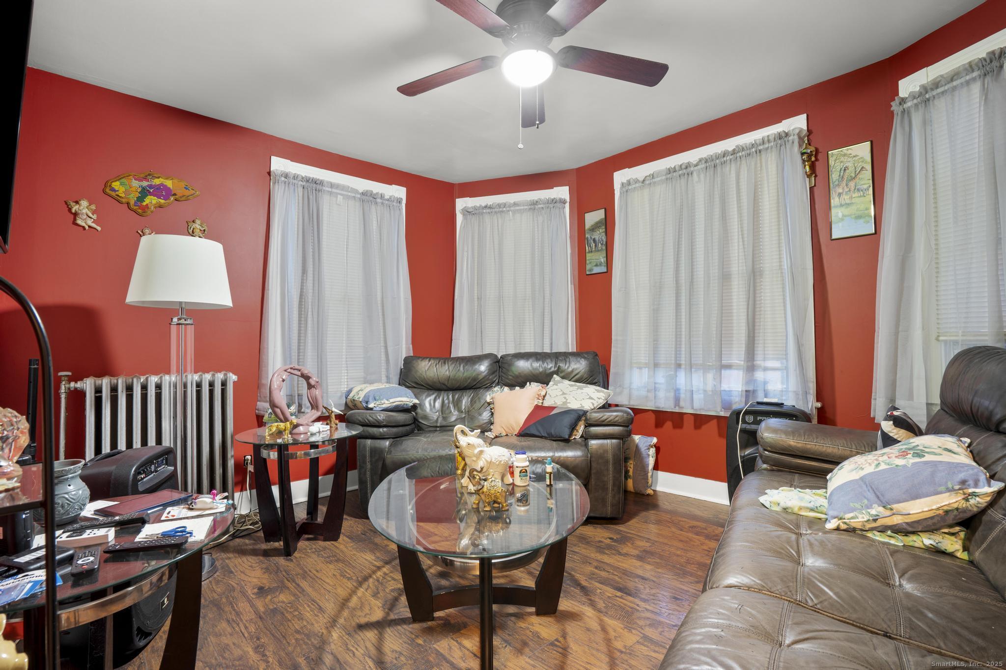 865 Iranistan Avenue Bridgeport, CT 06605 - Photo 21 of 35 a living room with furniture and a large window