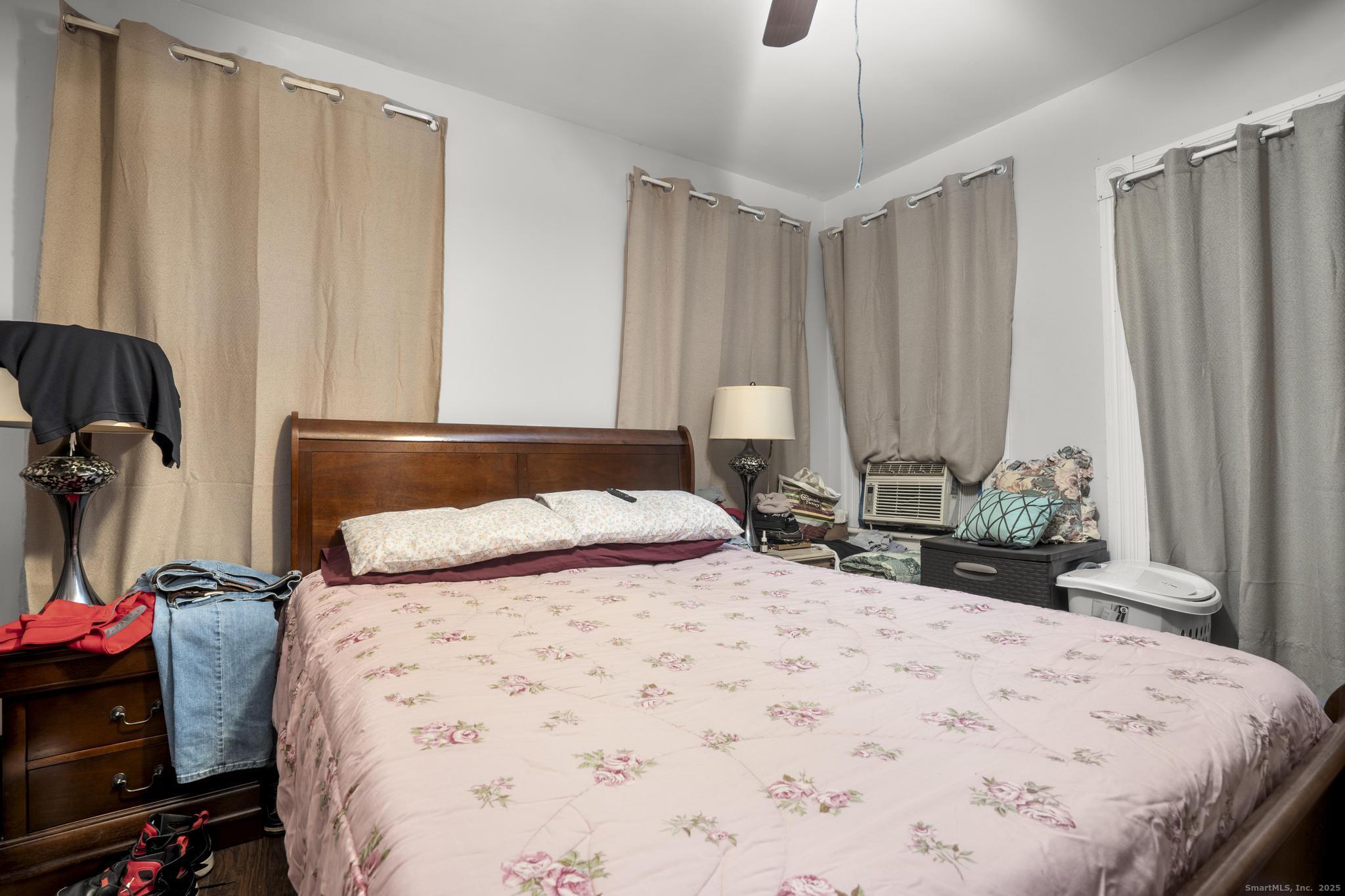 865 Iranistan Avenue Bridgeport, CT 06605 - Photo 23 of 35 a bedroom with a bed and a dresser