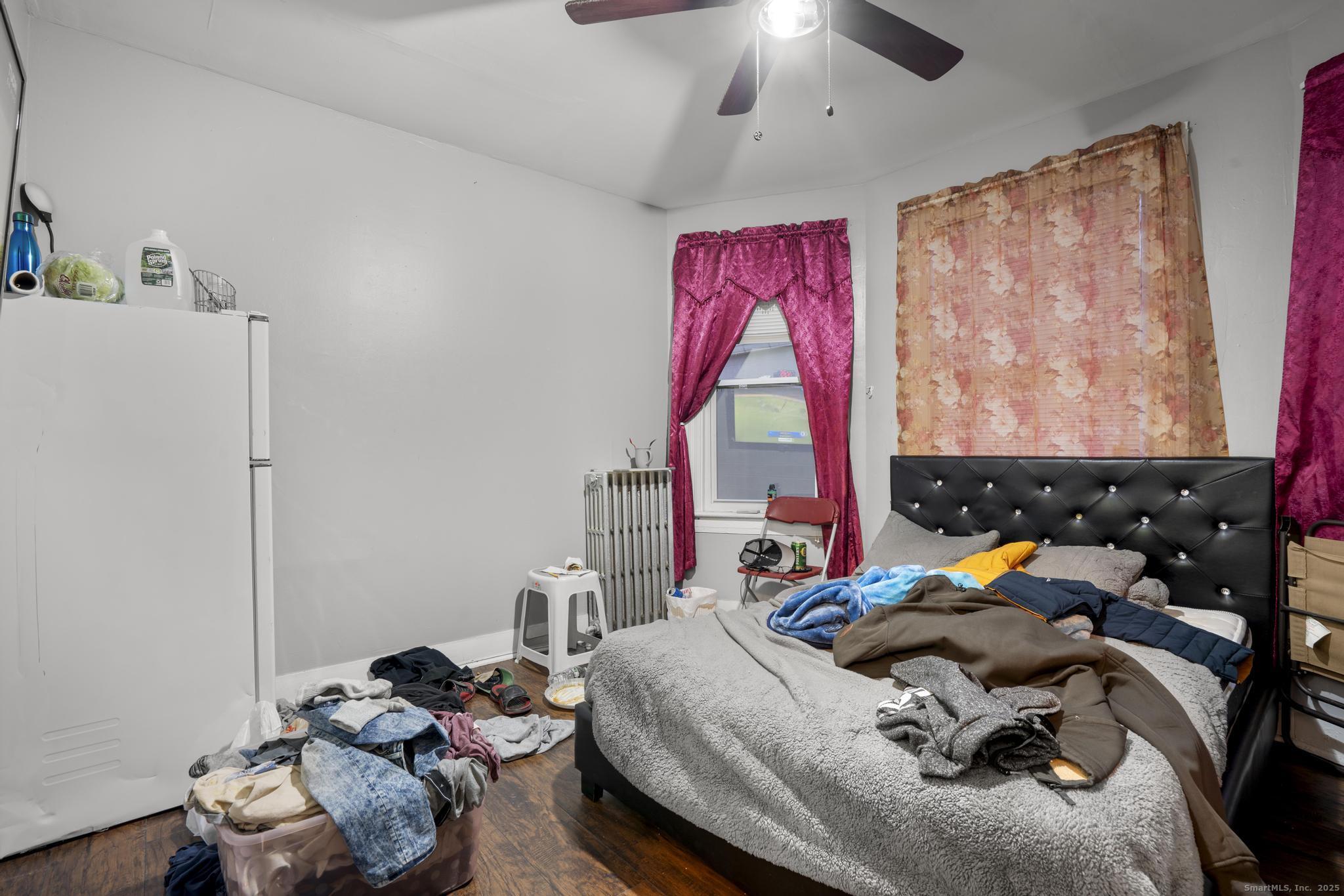 865 Iranistan Avenue Bridgeport, CT 06605 - Photo 27 of 35 a bedroom with furniture and a bed