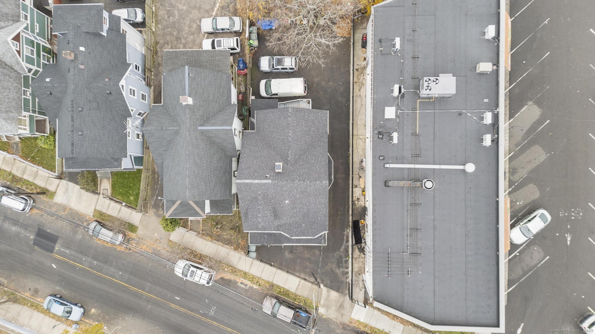 865 Iranistan Avenue Bridgeport, CT 06605 - Photo 4 of 35 a bathroom with a granite countertop shower and a mirror