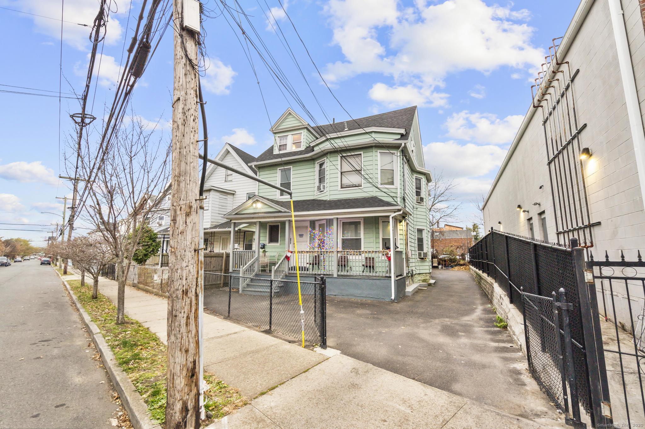 865 Iranistan Avenue Bridgeport, CT 06605 - Photo 5 of 35 a view of a building with a outdoor space