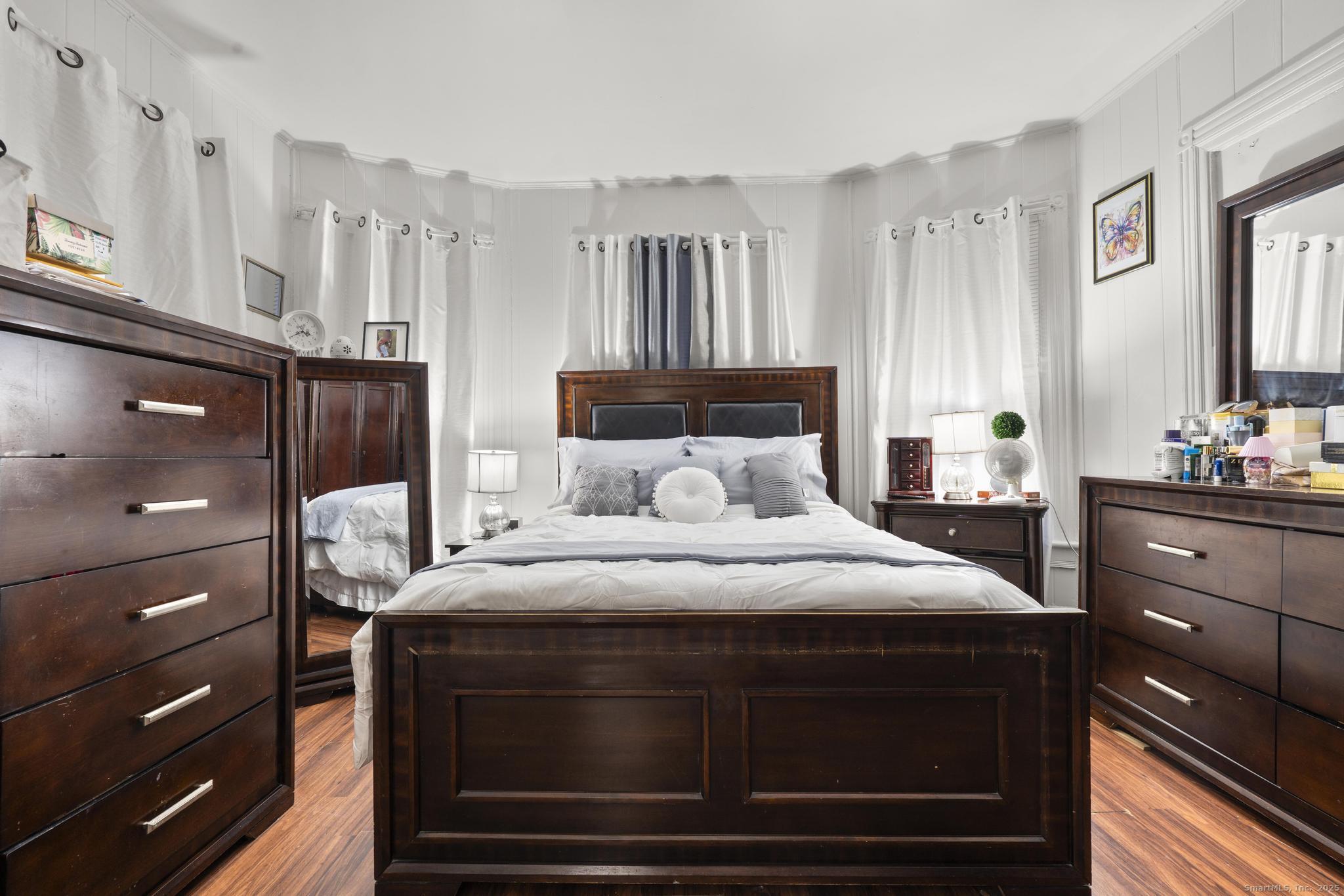 865 Iranistan Avenue Bridgeport, CT 06605 - Photo 10 of 35 a bedroom with a bed and a cabinets