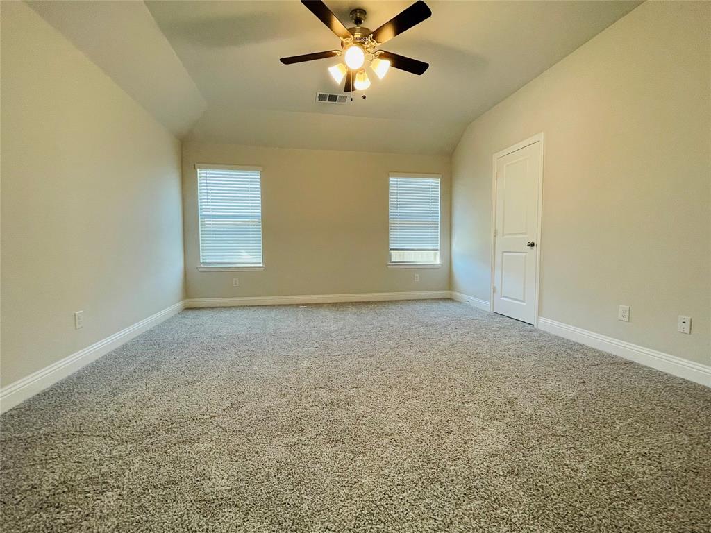 2131 Erika Lane Forney, TX 75126 - Photo 12 of 20 a view of an empty room and window with a fan