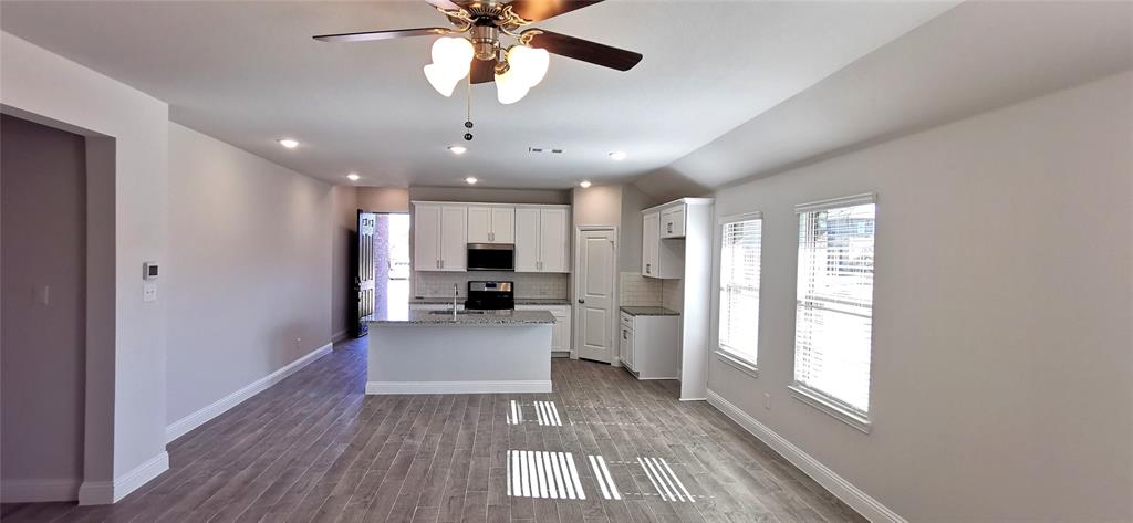 2131 Erika Lane Forney, TX 75126 - Photo 9 of 20 a view of a living room and a kitchen