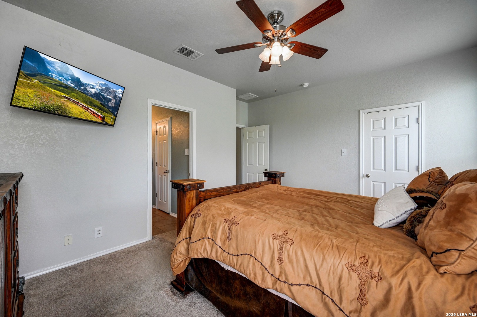 720 Hollow Ridge Schertz, TX 78108 - Photo 16 of 27 a bedroom with a bed and a chandelier