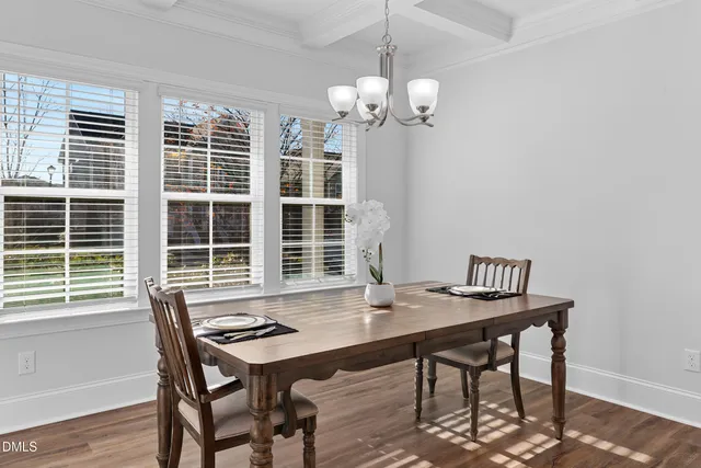 a view of a table and chairs in a room