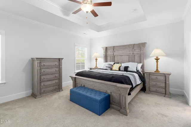 a bedroom with a bed and dresser