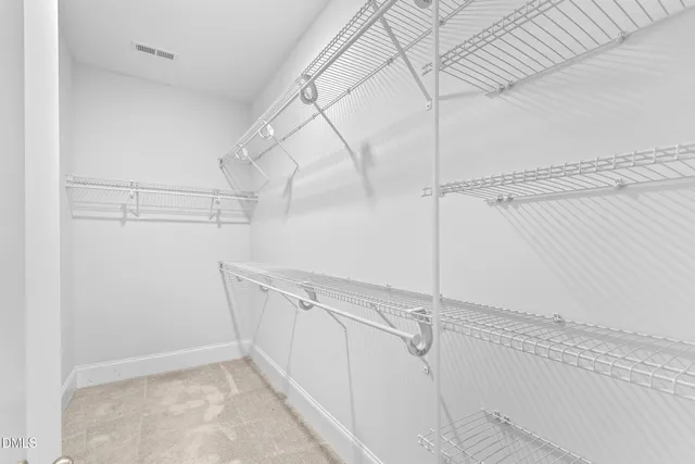 a view of a room with racks on the wall