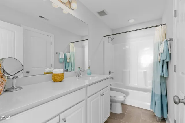a view of bathroom with a sink toilet and shower