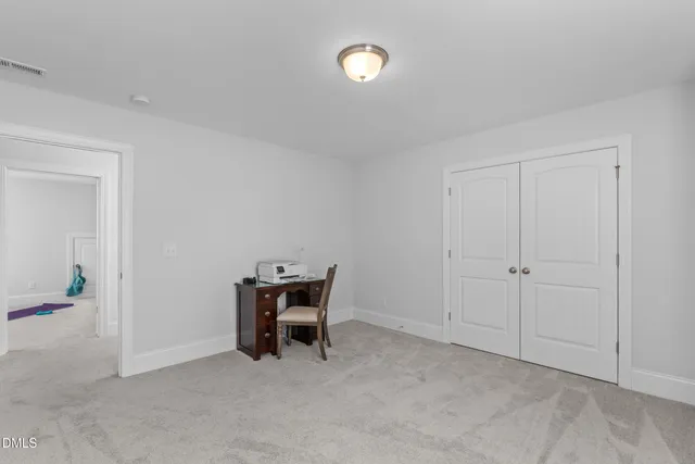 a living room with furniture a mirror