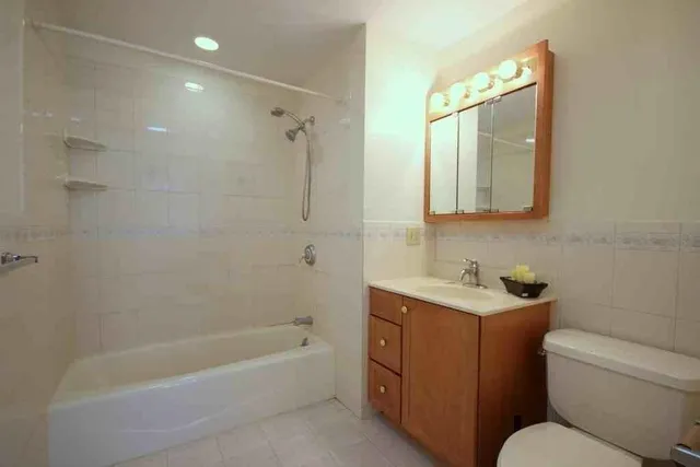 a bathroom with a toilet sink and bathtub