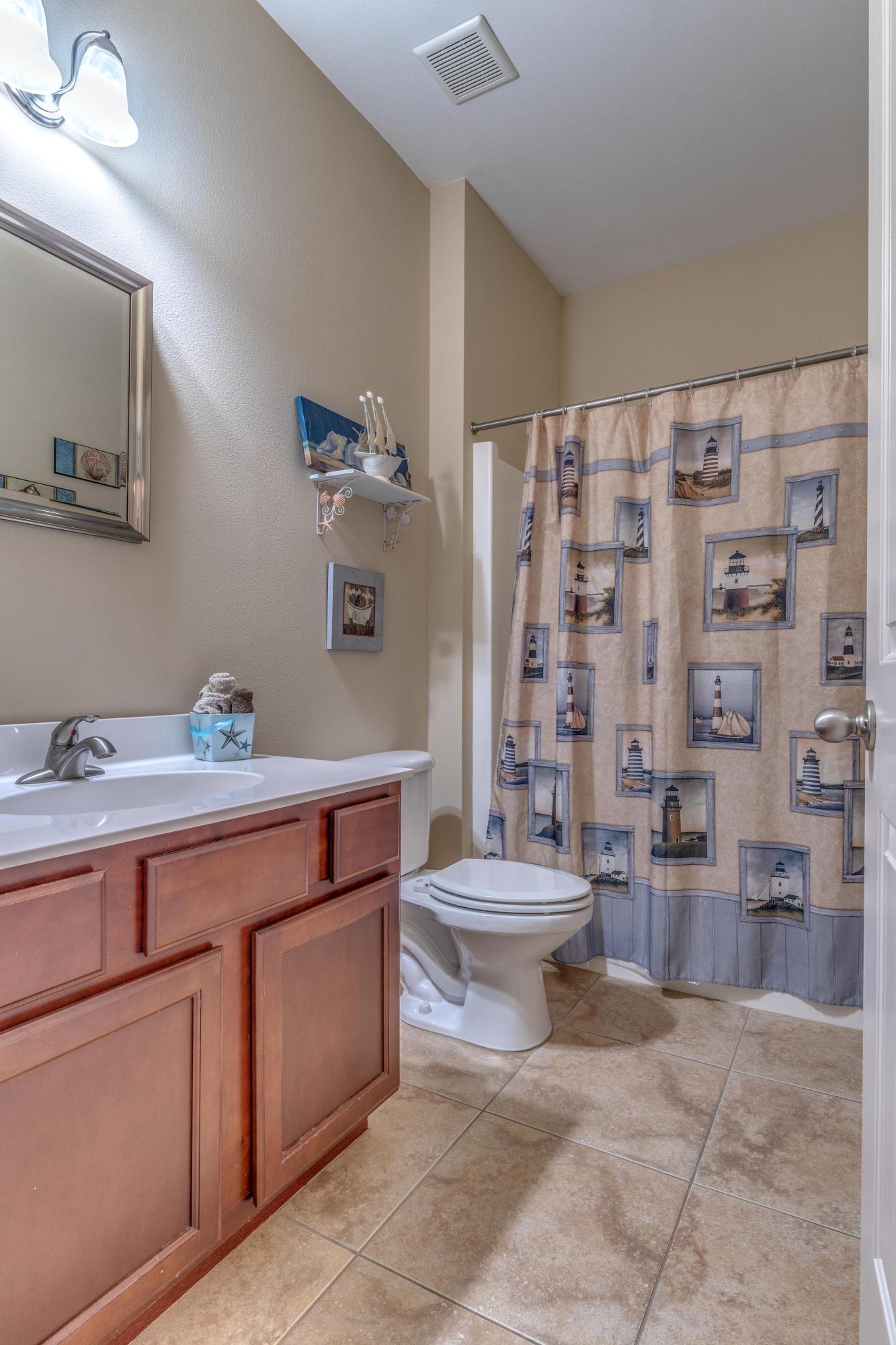 180 Peoria Boulevard Crestview, FL 32536 - Photo 13 of 33 a spacious bathroom with a toilet sink and shower