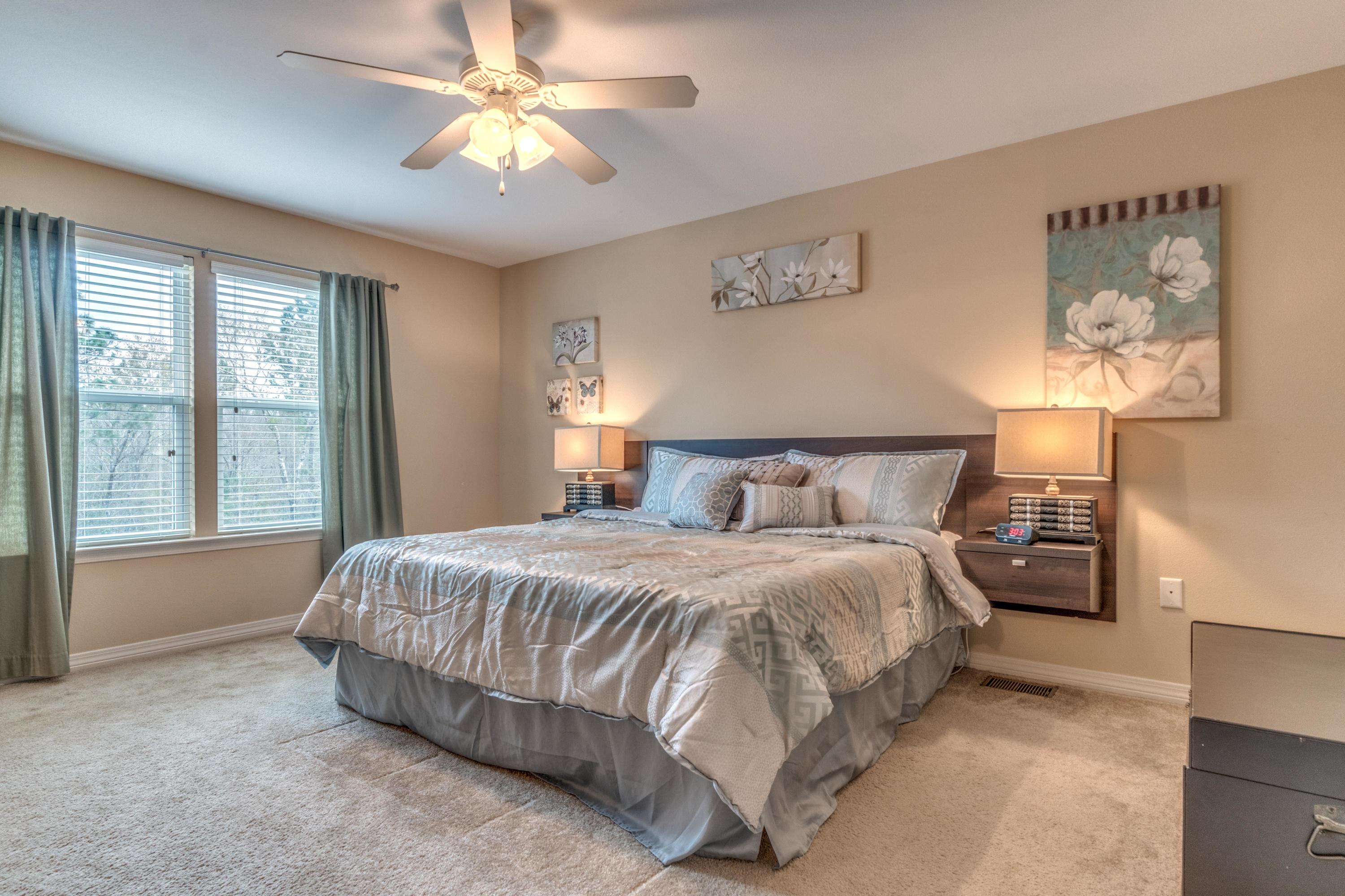 180 Peoria Boulevard Crestview, FL 32536 - Photo 15 of 33 a bedroom with a bed and a chandelier