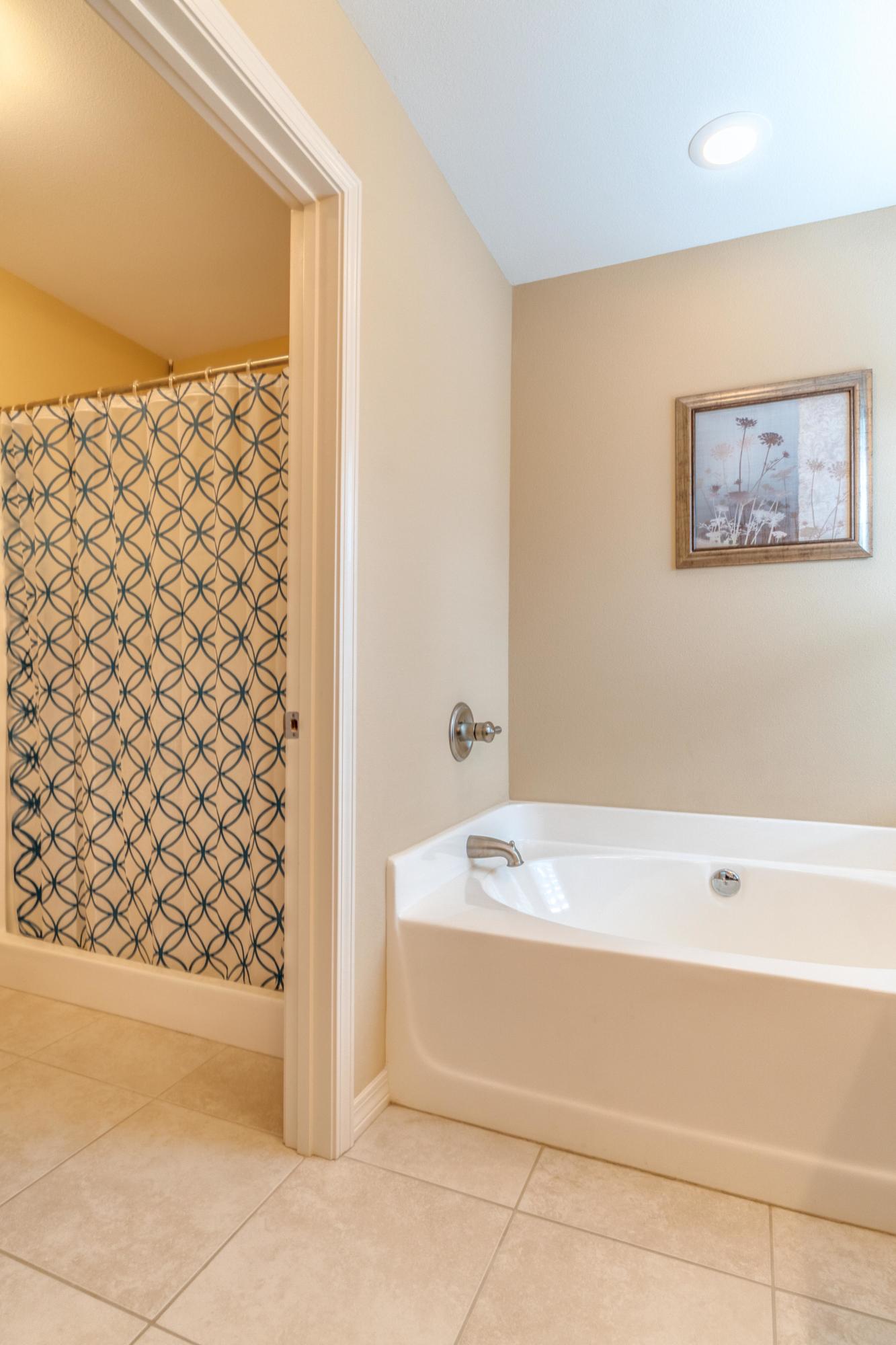 180 Peoria Boulevard Crestview, FL 32536 - Photo 19 of 33 a bathroom with a bathtub and a shower