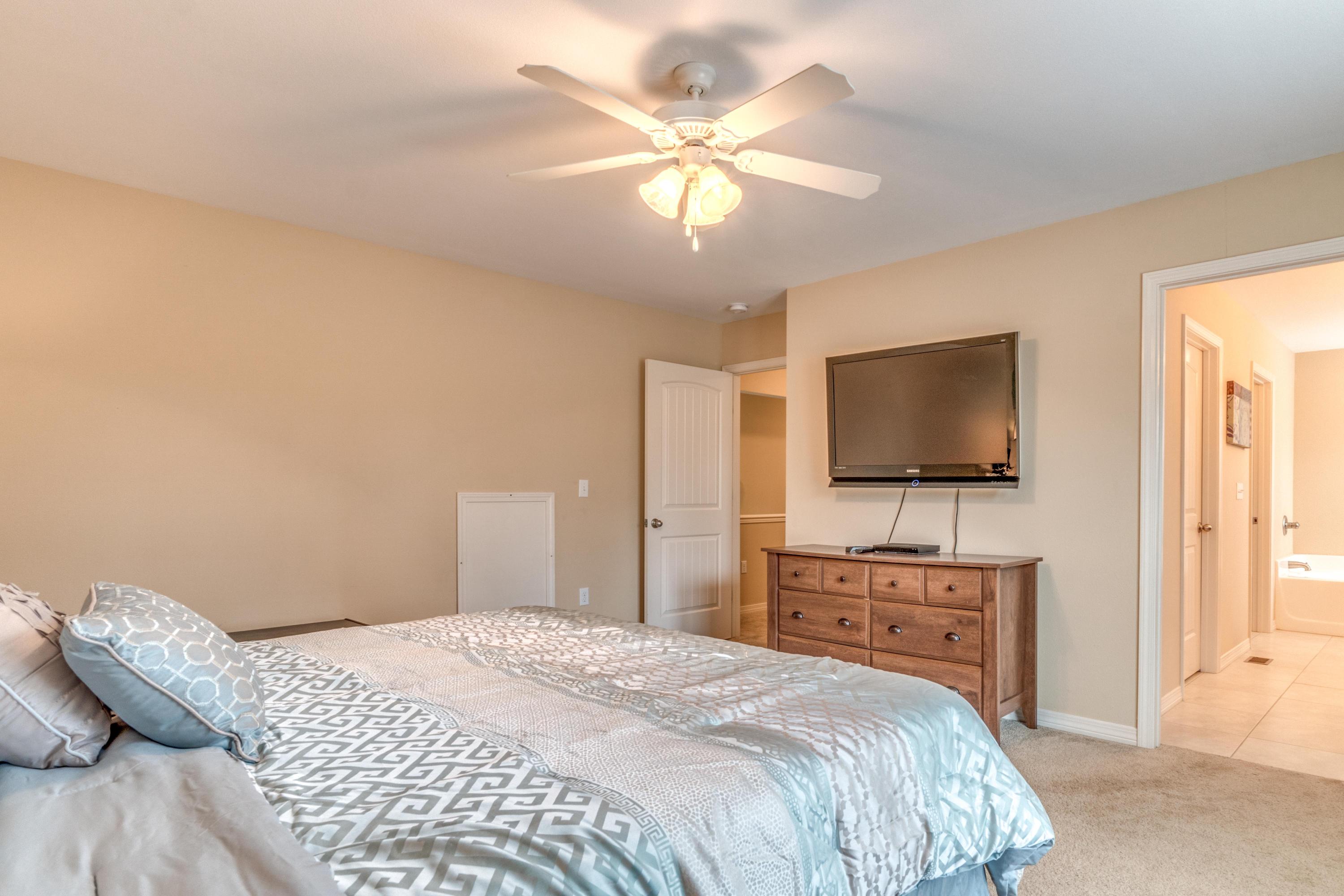 180 Peoria Boulevard Crestview, FL 32536 - Photo 20 of 33 a bedroom with a bed and a flat screen tv