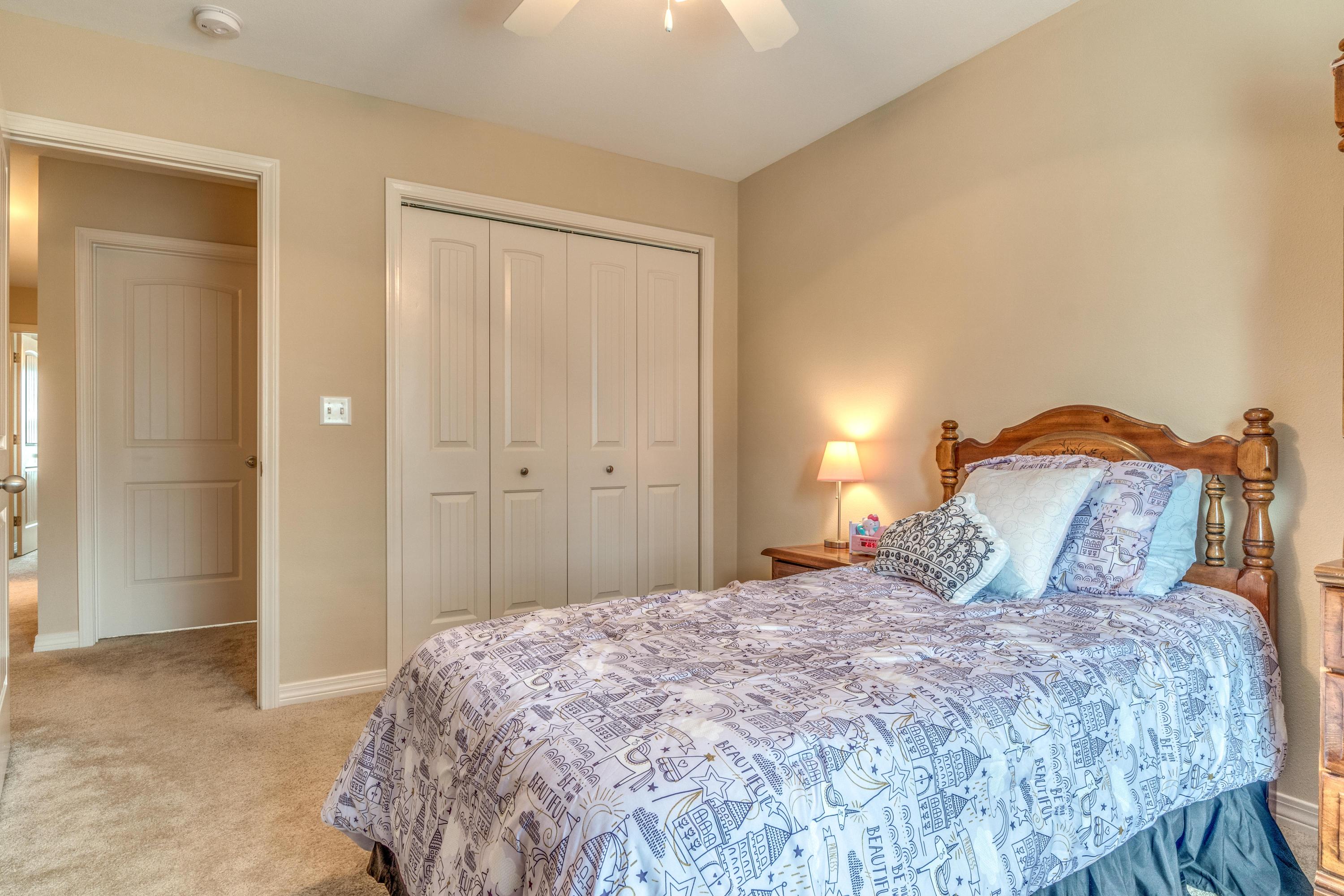 180 Peoria Boulevard Crestview, FL 32536 - Photo 22 of 33 a bedroom with a bed and a lamp with closet
