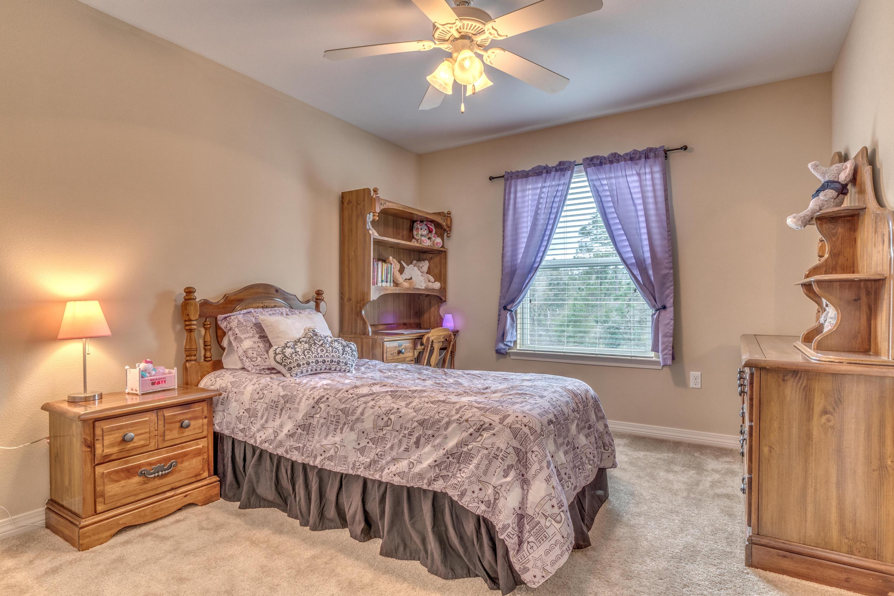 180 Peoria Boulevard Crestview, FL 32536 - Photo 23 of 33 a bedroom with a bed dresser and a window