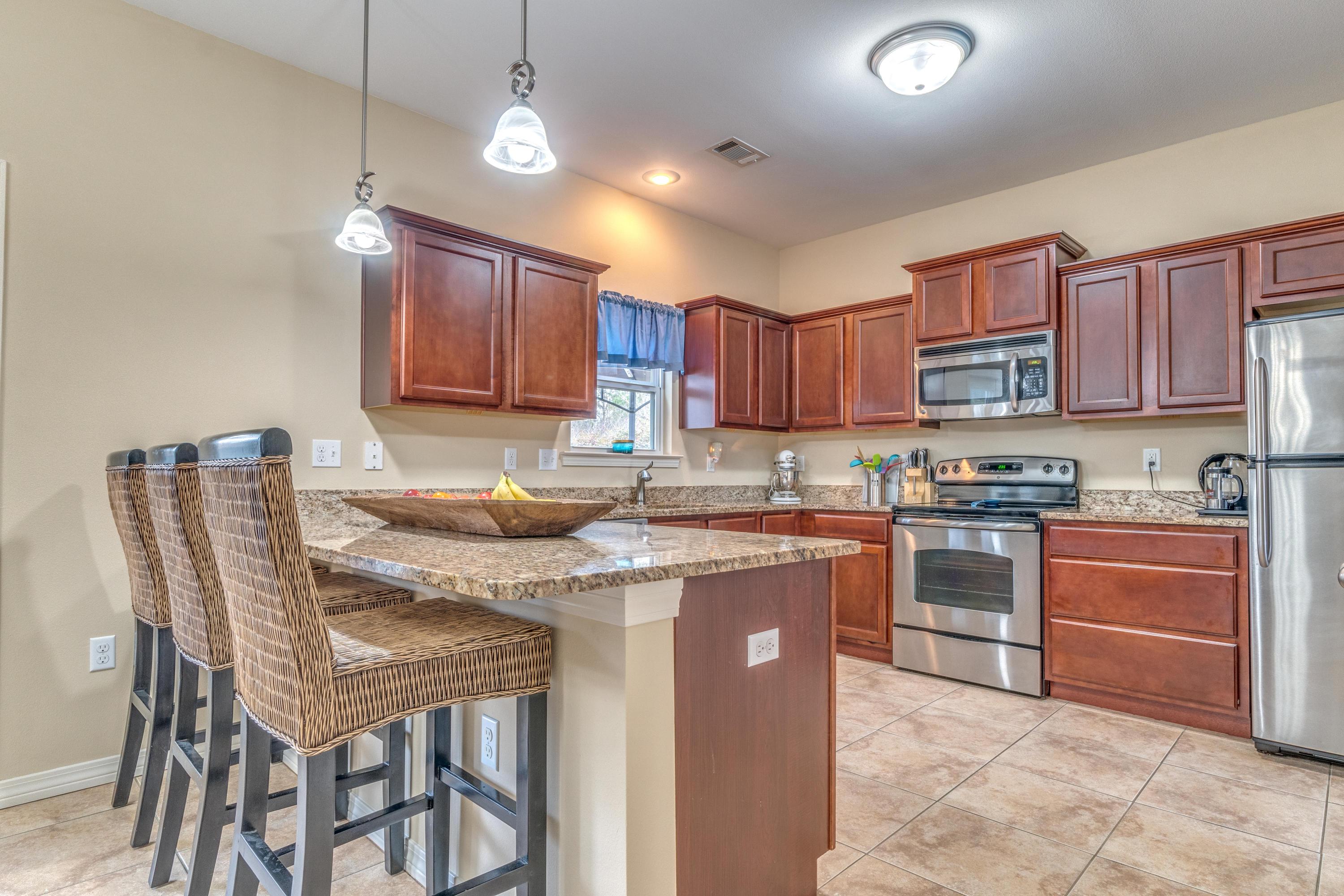 180 Peoria Boulevard Crestview, FL 32536 - Photo 8 of 33 a kitchen with stainless steel appliances granite countertop a stove sink and cabinets