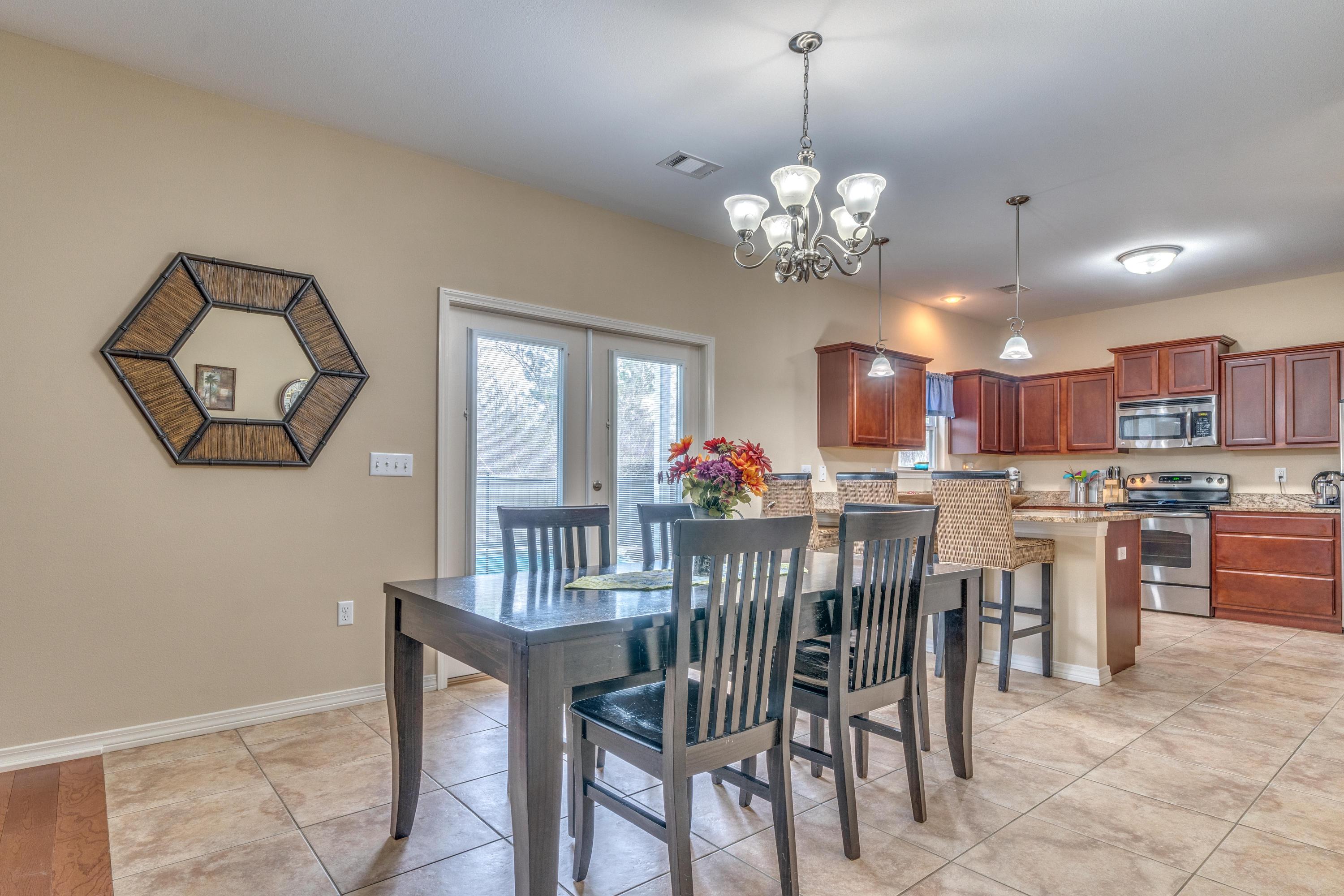 180 Peoria Boulevard Crestview, FL 32536 - Photo 9 of 33 a view of a dining room with furniture and a chandelier