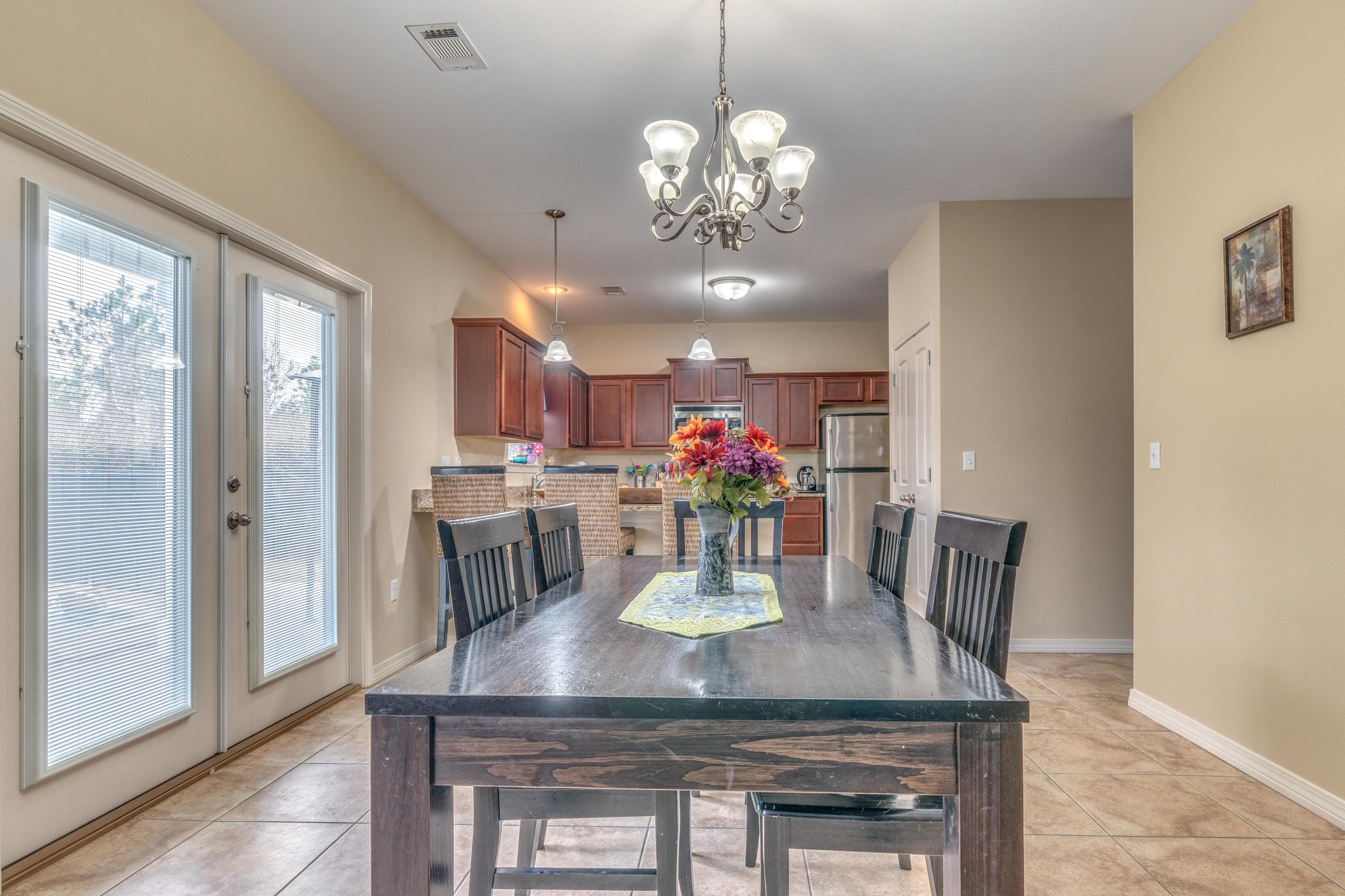 180 Peoria Boulevard Crestview, FL 32536 - Photo 10 of 33 a view of a dining room with furniture and chandelier