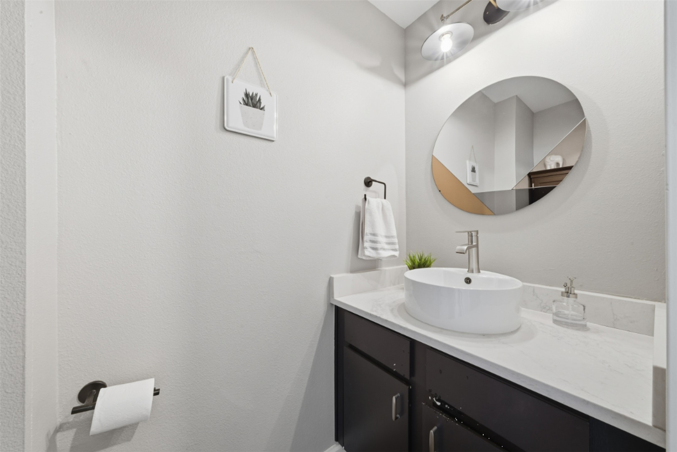 1201 Grove Boulevard, Unit 1304 Austin, TX 78741 - Photo 18 of 19 a bathroom with a sink and a mirror